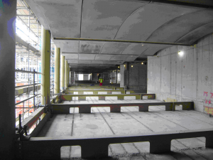 Fig 3 Exposed concrete floors supported on steel beams and used to provide thermal mass.png
