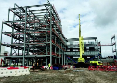 One of the four 2m deep beams forming the loading bay is lifted into position
