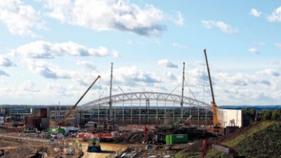 A total of 13 arched trusses form the signature structure