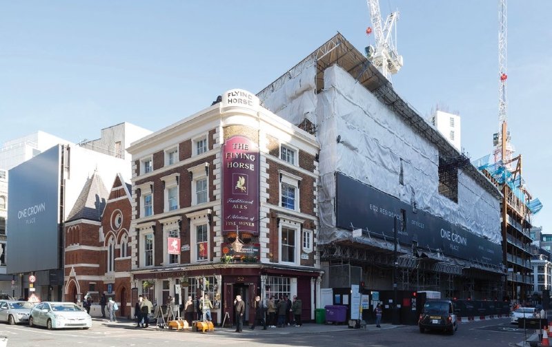 The overall project includes a number of retained elements including a pub and a Georgian façade (under wraps)