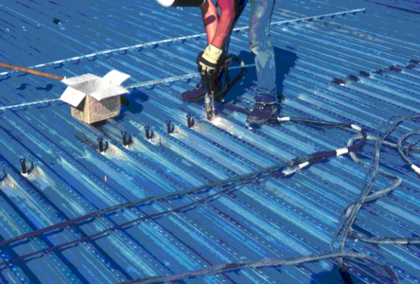 Through deck welding of shear studs (transverse re-entrant decking)