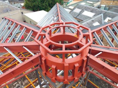 The origami-style roof radiates out from a central ring beam