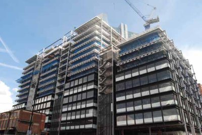 Cladding begins to be installed