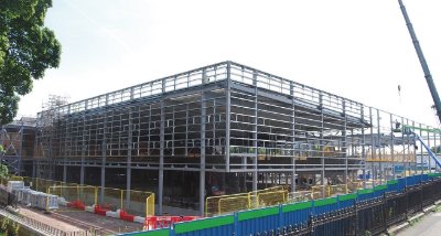 A steel-framed solution was chosen because the material could economically form the required long internal spans
