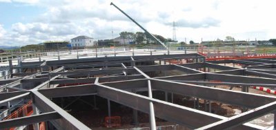 A complex pattern of steelwork forms the zone where the two wings meet