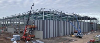 The cladding installers follow-on close behind the steel erection team