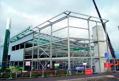 Mobile cranes help to erect the new build