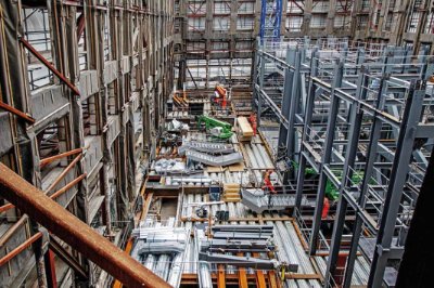 The new frame rises up within the retained façades