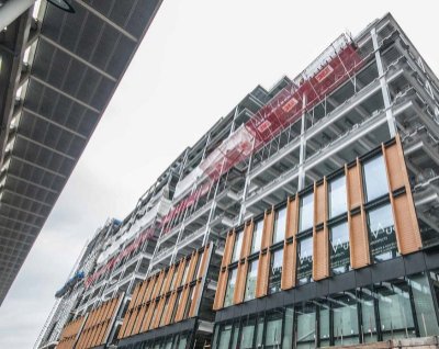 The building is clad in terracotta and glass