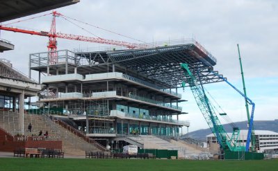The last steel sections for the roof are lifted into place