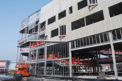 The structure’s grid alters to accommodate a ground floor drama space