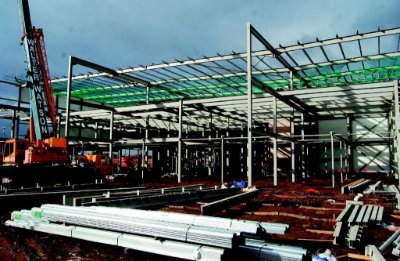 The new frame sits adjacent to the existing building