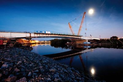 Steel was erected by cranes positioned on the river banks to avoid any work in or over the river