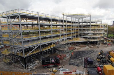 The steel frame forms a V-shaped structure, with the widest part facing the stadium