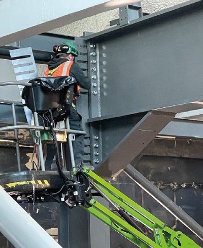 Tricky bolted connections, for the new steelwork, are made close to the existing structure