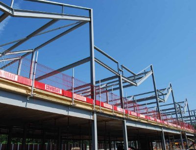 The distinctive saw-tooth roof is formed by a series of cranked rafters