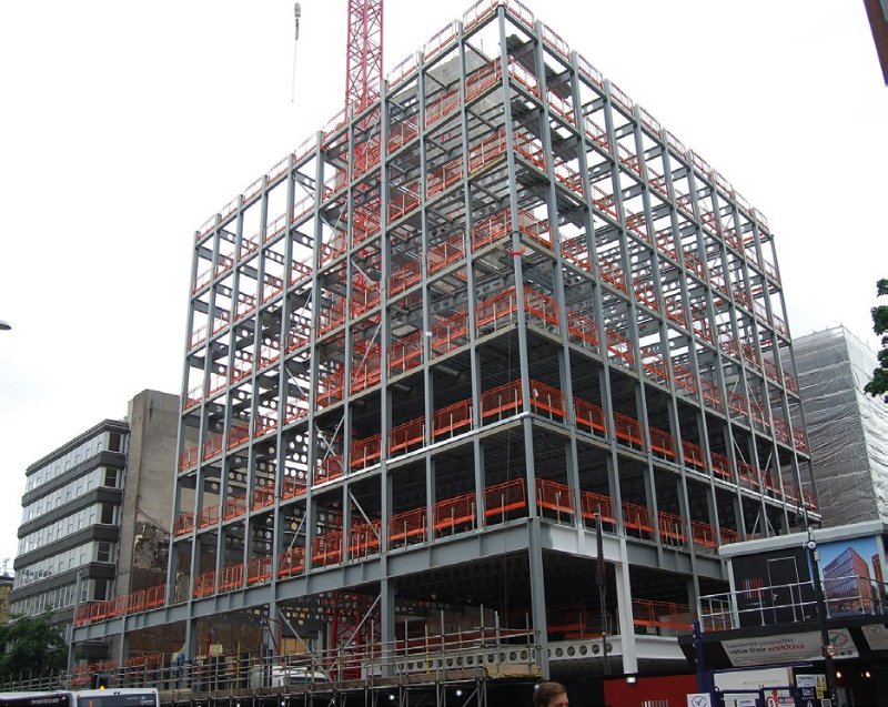 Transfer beams form a ring at second floor level to allow fewer columns on the lower levels