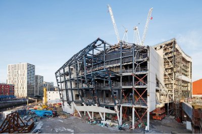 Cranked steel members form the building's signature curved facade