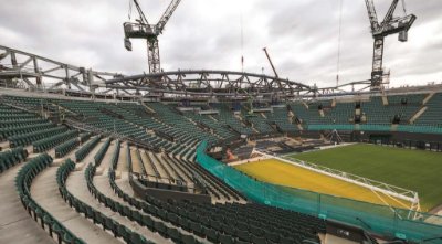 Five trusses that support the retractable roof trusses surround the court