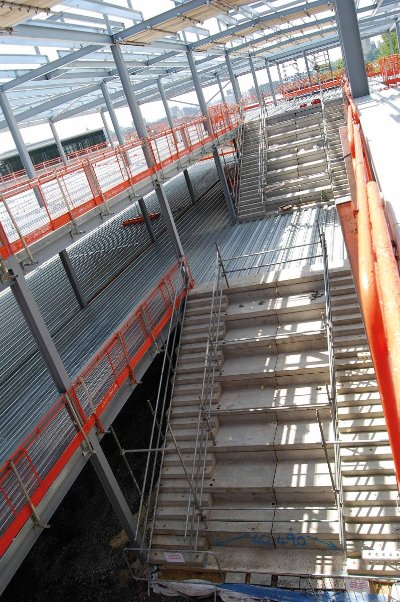 An atrium and main staircase are located in the middle of the classroom block