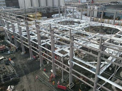 The steel mezzanine level has holes through which brewing vessels will protrude