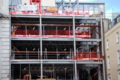 Temporary props support the adjacent buildings during construction