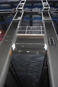 The western elevation's ladder frames have a kink at second floor level to accommodate the changing profile of the cladding